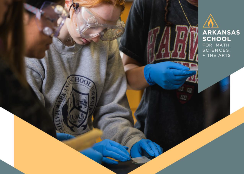 A cover image of student scientists featured on a quarterly report.